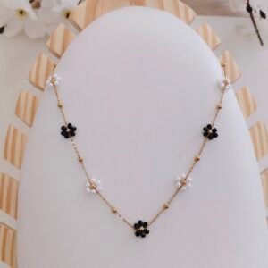 black & pearl floral station necklace